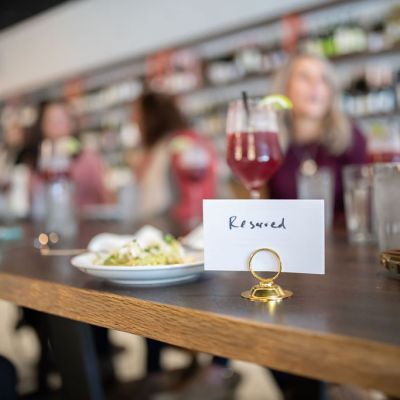 a person sitting at a table in a restaurant