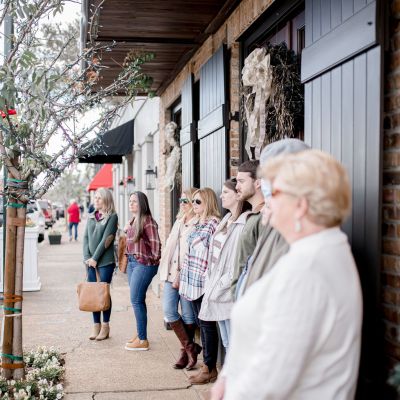 a group of people walking down a street
