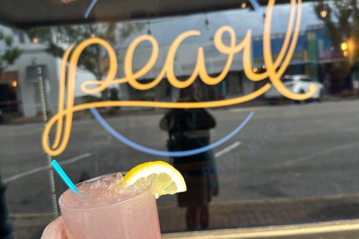 a hand holding a cell phone